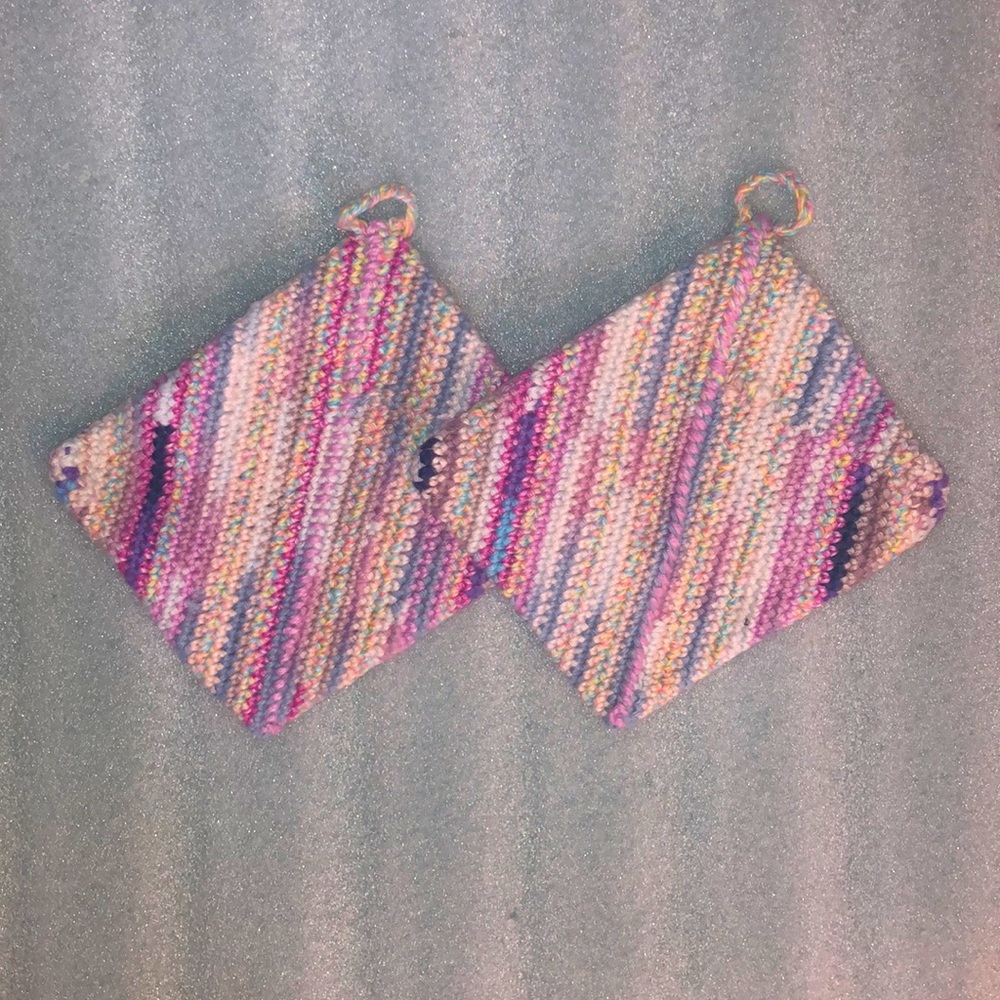 Pinks, purples, and blues crochet cotton pair of potholders